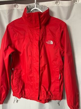 The North Face Vibrant Red Women's Lightweight Jacket With Stowaway hood. XS.